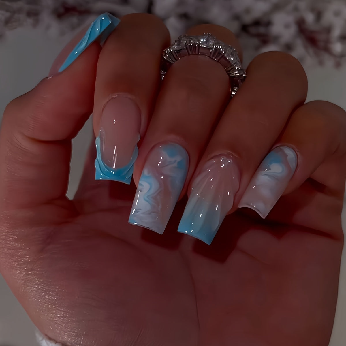 A Set of 24 Full-Cover Press-On Fake Nails Featuring Blue Wave Designs, Sparkling Diamonds, And Cloud Patterns in a Blue French Style, Along with Three-Dimensional Gel Stripes. These Medium Square-Shaped Fashionable Press-On